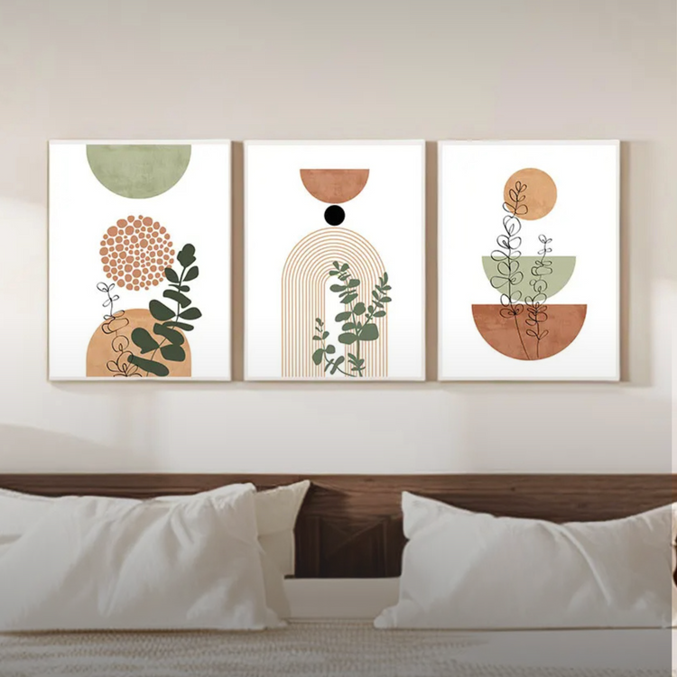 Scandi boho three piece set wall art canvas posters framed on a bedroom wall above a bed